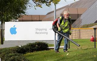Image: A worker blows leaves away from the Apple campus in Cork, Ireland in this 2014 file photo. Image: A worker blows leaves away from the Apple campus in Cork, Ireland in this 2014 file photo.