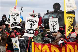 Image: Dakota Access Pipeline protesters square off against police Image: Dakota Access Pipeline protesters square off against police