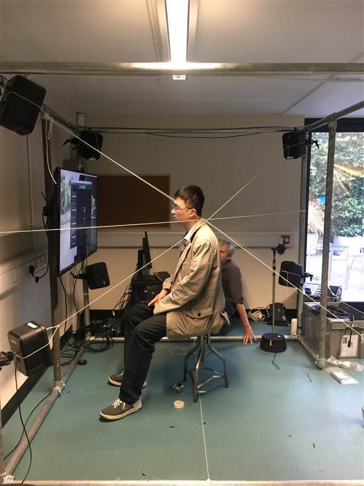 Image: A spectator watches 'RIOT', a movie being exhibited at New York's Future of Storytelling Image: A spectator watches 'RIOT', a movie being exhibited at New York's Future of Storytelling