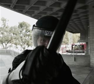 Image: A still from the movie "RIOT", which individual users stand in front of to watch as their emotions are read Image: A still from the movie "RIOT", which individual users stand in front of to watch as their emotions are read