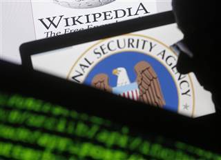 Image: A man is seen near cyber code and the U.S. National Security Agency logo in this photo illustration taken in Sarajevo Image: A man is seen near cyber code and the U.S. National Security Agency logo in this photo illustration taken in Sarajevo