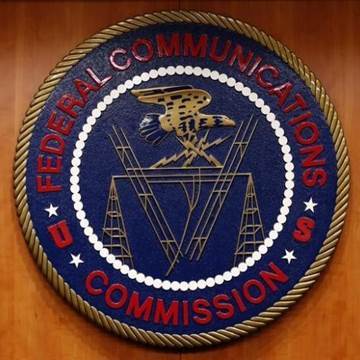 The Federal Communications Commission (FCC) logo is seen before the FCC Net Neutrality hearing in Washington