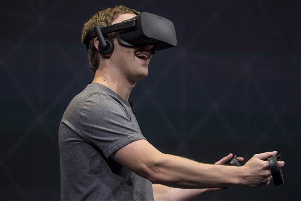 Image: Facebook founder and CEO,Mark Zuckerberg, demonstrates an Oculus Rift virtual reality (VR) headset and Oculus Touch controllers as the gives a demonstration during the Oculus Connect 3 event in San Jose, Calif., on Oct. 6, 2016. Image: Facebook founder and CEO,Mark Zuckerberg, demonstrates an Oculus Rift virtual reality (VR) headset and Oculus Touch controllers as the gives a demonstration during the Oculus Connect 3 event in San Jose, Calif., on Oct. 6, 2016.
