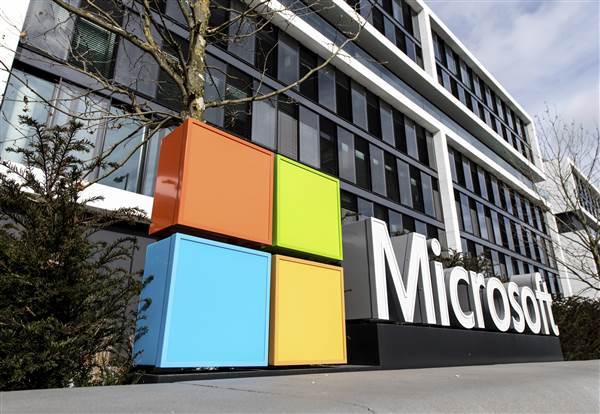 Image: The Microsoft logo on the facade of a Miscrosoft Center. Image: The Microsoft logo on the facade of a Microsoft Center.