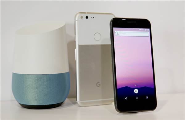 The new Google Pixel phone is displayed next to a Google Home smart speaker Image: The new Google Pixel phone is displayed next to a Google Home smart speaker