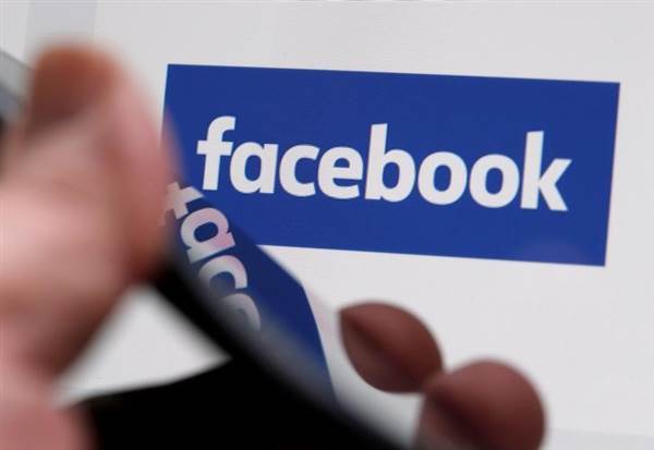 FILE PHOTO: The Facebook logo is displayed on the company's website in an illustration photo taken in Bordeaux, France FILE PHOTO: The Facebook logo is displayed on the company's website in an illustration photo taken in Bordeaux, France